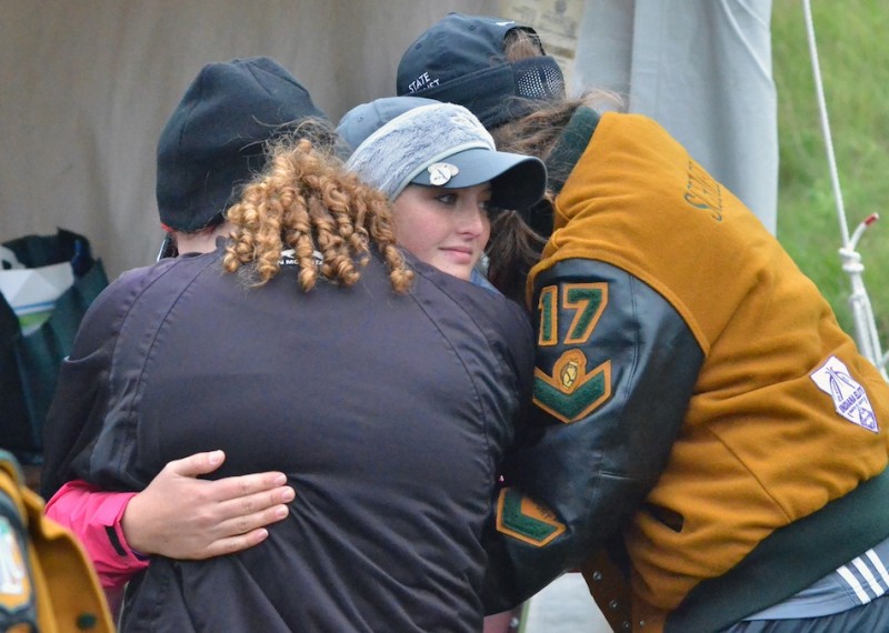 Wawasee's Madison Beaman (left) and Aubrey Schmeltz (right) embrace senior Elizabeth Jackson (center) after she finished her prep career Saturday afternoon at the IHSAA State Finals. (Photos by Nick Goralczyk)