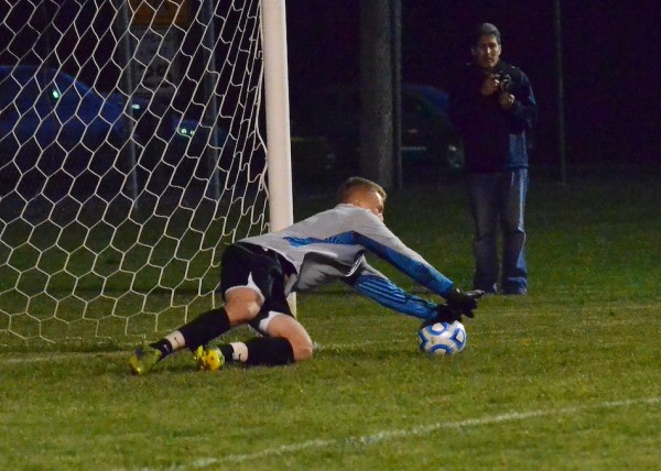 Peyton Long narrowly makes this save late in the sectional contest Monday night in Plymouth.