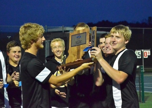 The Warsaw boys tennis team, shown with the sectional trophy, meets Plymouth in a regional showdown Tuesday (File photo by Nick Goralczyk)