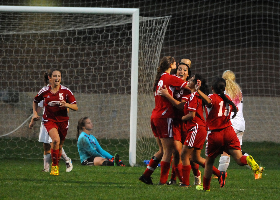 Goshen's Jelitza Palomino is mobbed by her teammates after scoring the lone goal of a 1-0 final in favor of Goshen over Warsaw in the Goshen Girls Soccer Regional semi-finals Wednesday. (Photos by Mike Deak)
