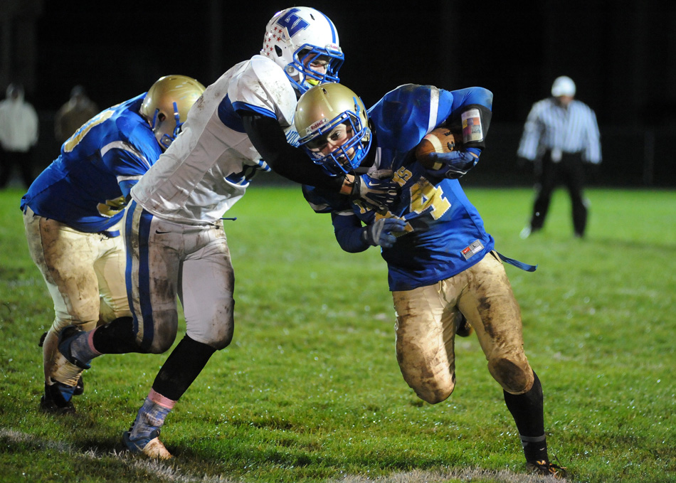 Triton running back Jeremy Jones tries to elude LaVille's Josiah Rock.