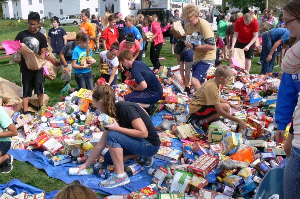 Students pick through donations to sort food items into groups.  (photo provided by Scott Wiley)