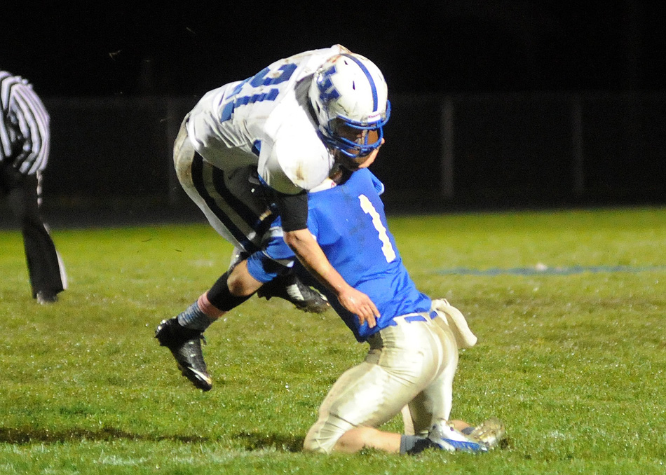 Triton's Grant Stichter stuffs LaVille running back Ethan Kertai on a fourth down play in the first quarter.