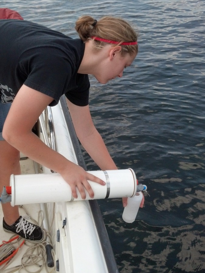 Grace College undergraduate student and Center for Lakes & Streams research assistant Alixandra Underwood collects water samples from Lake Wawasee. (Photo Provided)