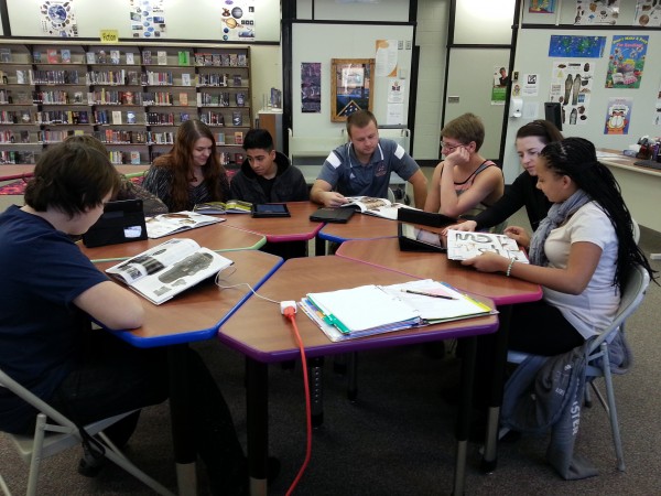 Mr. Lucht's class study nonfiction materials at the Gateway Library.  (Alyssa Richardson)