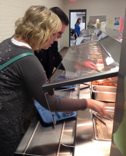 Syracuse-Wawasee Chamber of Commerce board members enjoyed a tour of Wawasee High School during their regular board meeting Nov. 5. The tour also included a lunch. Pictured is Tricia Small, a chamber board member, trying some of the food offered by WHS.
