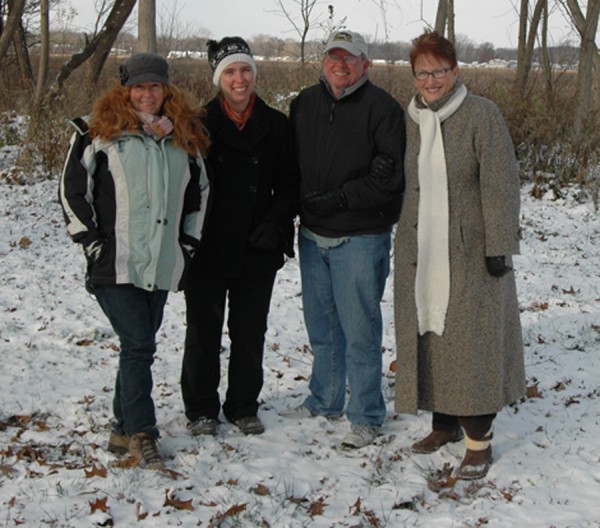 Heather Harwood, Wawasee Area Conservancy Foundation; Syracuse-Wawasee Trails Executive Director Megan McClellan; Sam Leman, WACF Chairman; and Kay Young, Wawasee Property Owners Association President , are shown on the site of a trail to be installed on WACF property. (Photo by Chelsea Los)