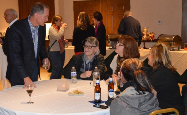 Nathan Wilson, left, the newly hired director of Chautauqua Wawasee chats with Dale Sherburn, Kristie Sherburn, Fran Clark and Tami Thompson about what types of programming they would like to see Chautauqua offer. A reception was held to welcome Wilson to Chautauqua at Oakwood Thursday. (Photo by Lauren Zeugner)