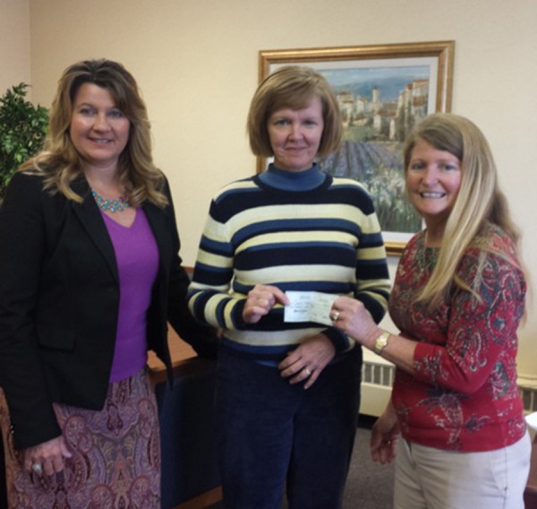 Pictured are Women of Today reps Kathy Siri (l) and Deb Webb (r) presenting the donation check to Cardinal Services CEO, Jane Wear (center). 