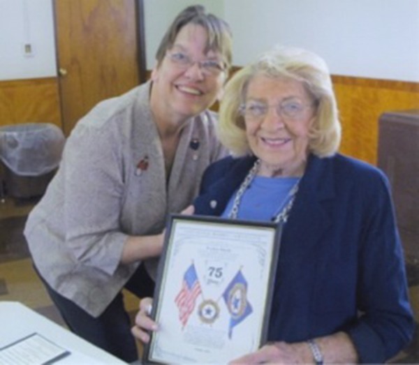Pictured are Warsaw Auxiliary president Kathy Snell, left, presenting the pin and plaque to Evelyn Marsh, right. (Photo provided)