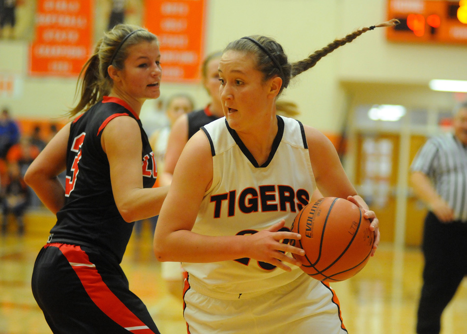 Warsaw's Pam Miller looks to move around Fort Wayne Luers' Kayla Knapke Tuesday night. (Photos by Mike Deak)
