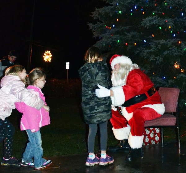 This youngster takes the opportunity to visit with Santa.