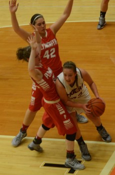 Pam Miller of Warsaw tries to avoid a Plymouth defender (Photo by Scott Davidson)