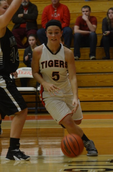 Page Desenberg drives the baseline for the Tigers.