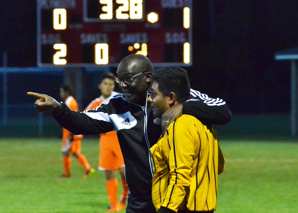 Warsaw's Frank Courtois talks with an official during the soccer sectional in October. Courtois was named tonight as the new WCHS boys soccer coach (File photo by Nick Goralczyk)