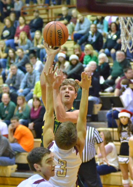 Gage Reinhard takes a contested shot Tuesday night at Columbia City. (Photos by Nick Goralczyk)