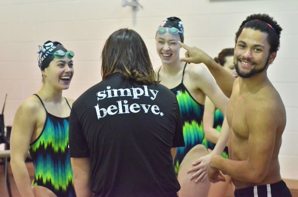 Members of the Wawasee boys and girls swim teams goof around during a break.