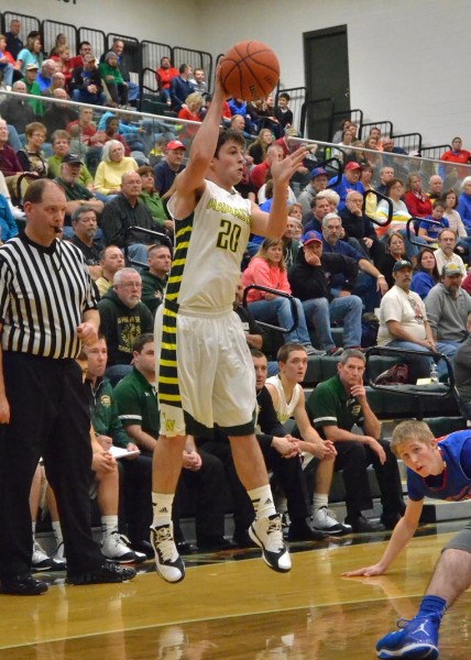 Jake Hutchinson passes the ball for Wawasee in Saturday's 69-48 win over West Noble. Hutchinson had 10 points. (Photos by Nick Goralczyk)