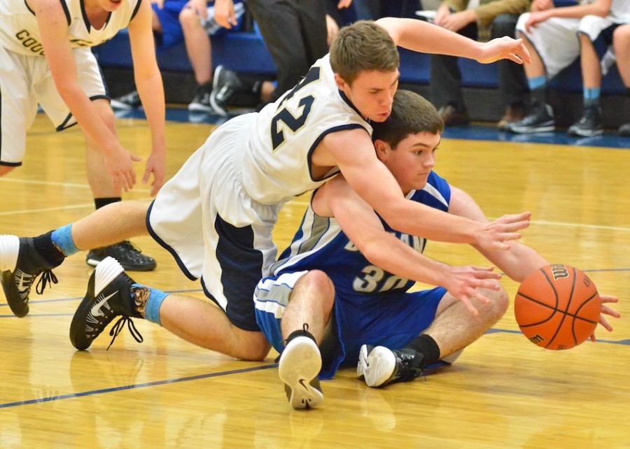 Kyle Shuler (42) dives for a loose ball over Bethany's Joel Miller.