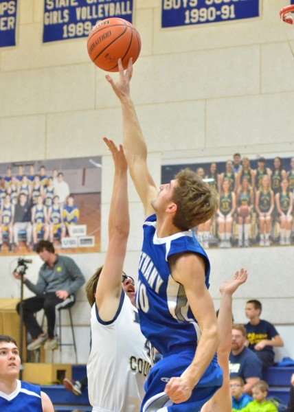 Sol Brenneman blocks a shot from LCA's Conner Blum. (Photos by Nick Goralczyk)