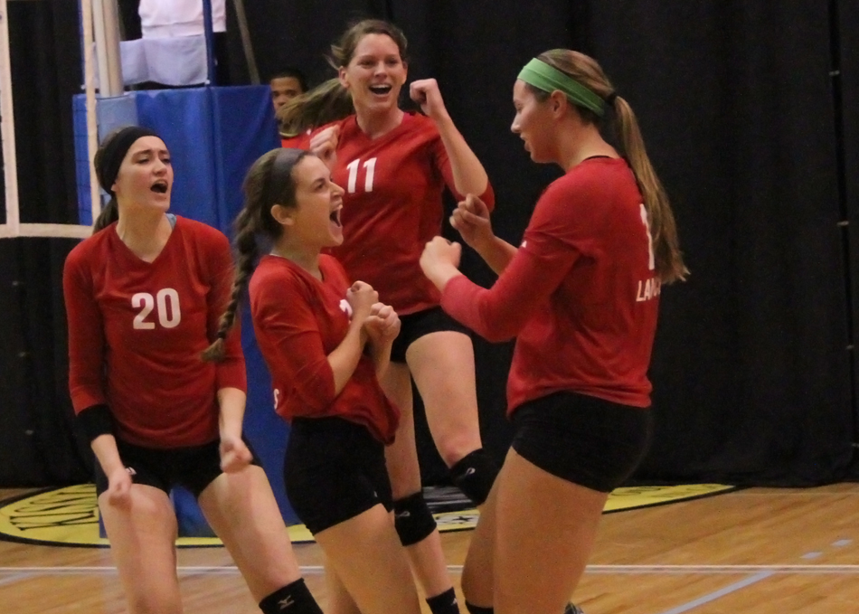 Grace College showed well at the NCCAAs, winning two games. Pictured are (left) Grace Woolsey, Jessica Scherb, Ellie Harp and Tori Bontrager celebrating a point against Oakland City Thursday. (Photo provided by the Grace College Sports Information Department)