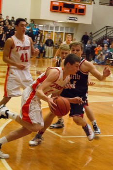 Sophomore Kyle Mangas drives for the Tigers. Mangas had 12 points Thursday night (Photo by Ansel Hygema)