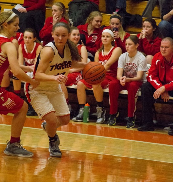 Warsaw's Mariah Rivera moves past a Plymouth defender Saturday night. Plymouth topped the host Tigers 41-26 in the conference opener (Photo by Ansel Hygema)