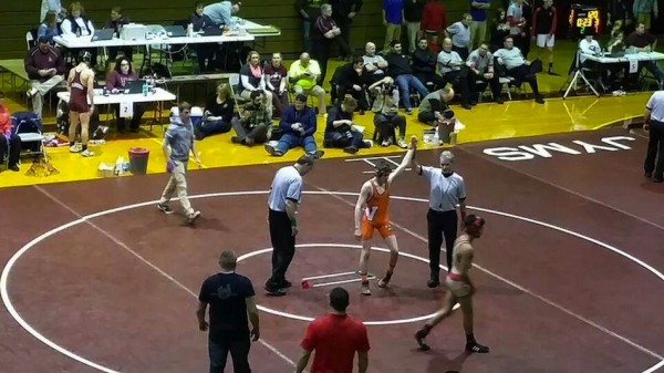 Kyle Hatch comes off the mat after a win on Wednesday in Mishawaka.
