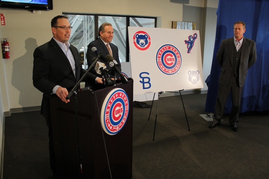 Team officials stand with the new logos at Thursday's unveiling. (Images provided by the South Bend Cubs)