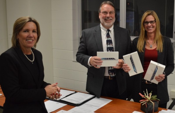 Holly Tuttle, left, of Women Today, donated three mini iPads to the Wawasee Community School Corp. to be used in each of the elementary schools. Shown accepting the iPads are Dr. Tom Edington, superintendent, and Rebecca Linnemeier, school board president.
