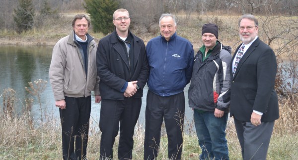 From left at the property are Bob Smith, Syracuse-Wawasee Rotary Charitable Foundation Inc. president; Erick Leffler, Syracuse-Wawasee Rotary Club president; Henry DeJulia, town manager; Jonsson; and Dr. Tom Edington, Syracuse-Wawasee Park Foundation president.
