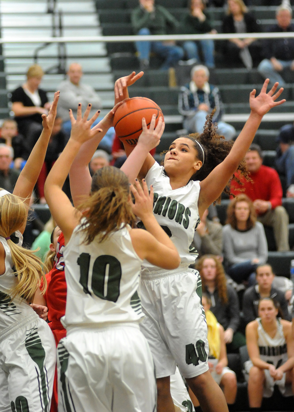 Wawasee's Seaquinn Bright, far right, swats away a West Noble shot attempt.