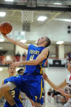 Triton's Joey Corder flies for a layup against NorthWood.