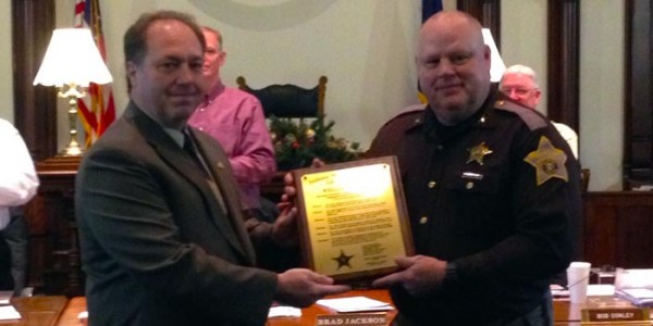 Incoming Kosciusko County Sheriff Aaron Rovenstine, left, presenting current Sheriff Rocky Goshert an Indiana Sheriff Association award.