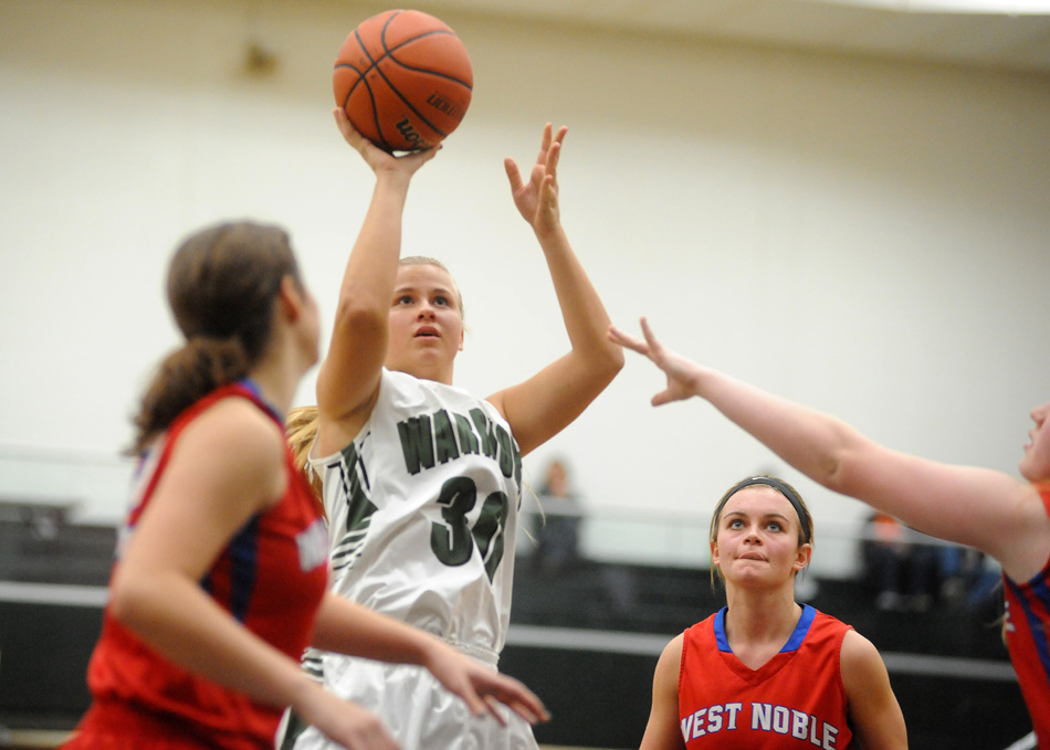 Wawasee's Kylee Rostochak puts up a shot against three West Noble defenders Tuesday night. (Photos by Mike Deak)