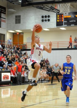 NorthWood's Braxton Linville flies in for a layup against Triton Friday night. Linville finished with 22 points in the 54-50 win over the Trojans. (Photos by Mike Deak)