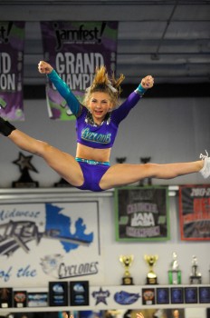 Midwest Xtreme's Madison Smith flies through the air during the C4 cheer routine. (Photos by Mike Deak)