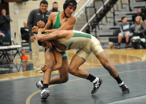 Concord's Zach Ramirez corrals Wawasee's Marcos Mejia.