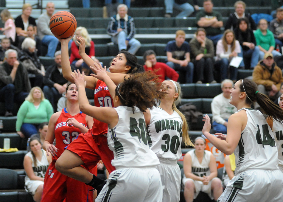 West Noble's Sandra Carrillo drives in for a shot attempt against Wawasee.