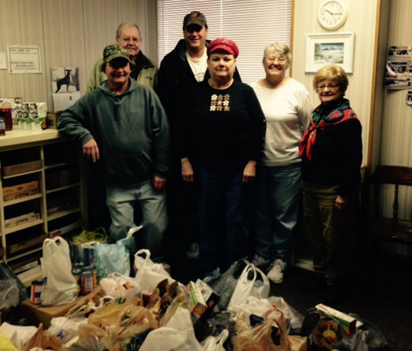 At the presentation of the goods and money to the North Webster Food Pantry were from the left front row, Nick Hatcher, Pie Eyed Petey’s and Bev Smitley, North Webster Food Pantry. In back were Poppy Smith and Brian Bensing, Petey’s; and Shirley Strock and Susane Gilliand, food pantry. (Photo provided) 