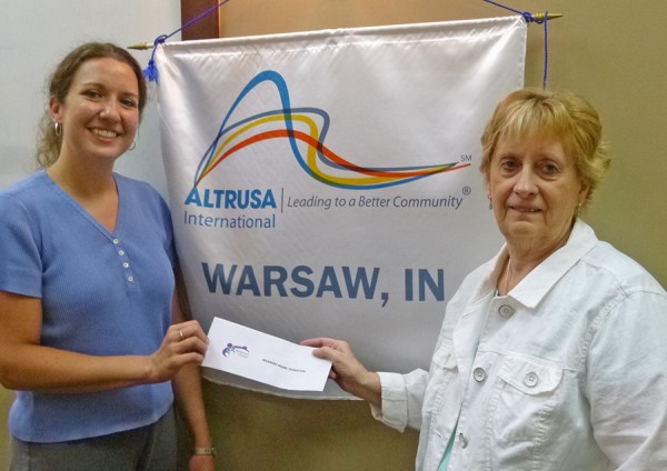 photo (L to R):  Beaman Home's executive director Tracie Hodson accepts a $2,000 donation from Altrusa-Warsaw's vice president, Jeanine Knowles.  The donation resulted from a grant provided by the Altrusa International Foundation matching a donation the local club made in November.