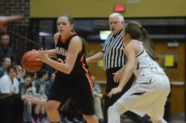 Madi Graham of Warsaw dribbles past a Penn defender Wednesday night. The host Kingsmen topped the Tigers 47-26.