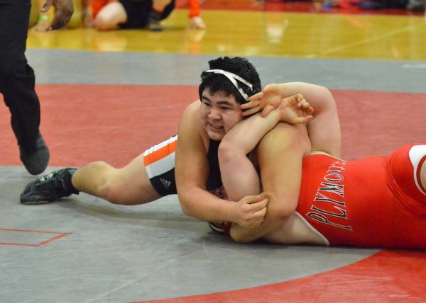 Anthony Penn goes beat mode on Plymouth's Tyler Milton during the heavyweight title match.