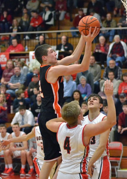 Kyle Mangas goes up for two between two GHS defenders.