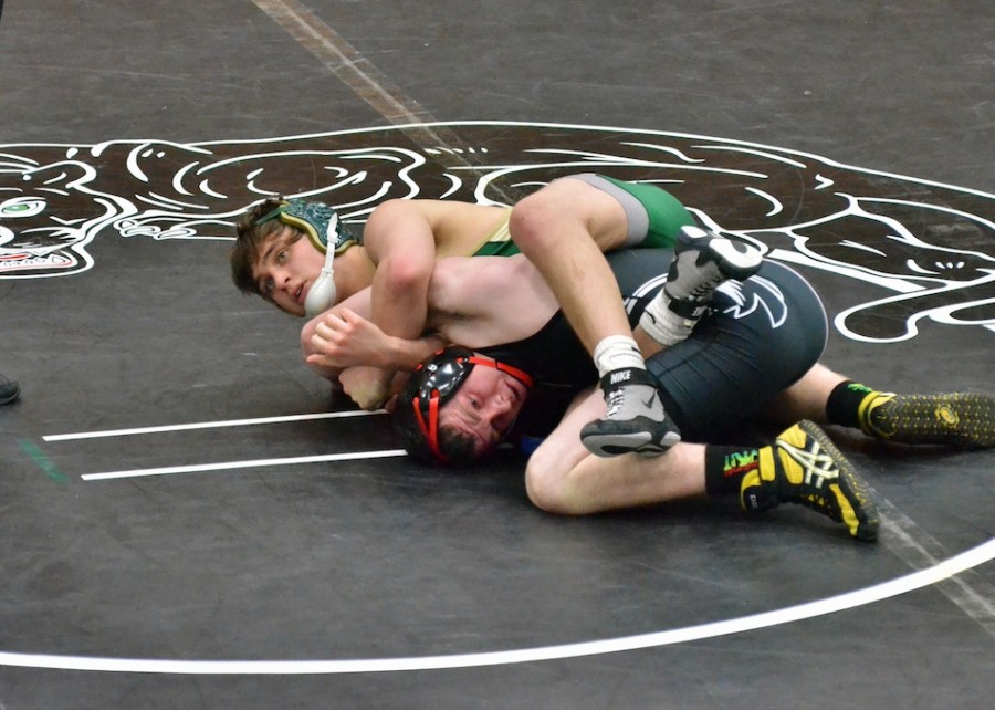 Wawasee's Zach Ford claimed an 8-6 decision over Scott Kern during NorthWood's 66-7 romp of the Warriors Thursday night. (Photos by Nick Goralczyk)