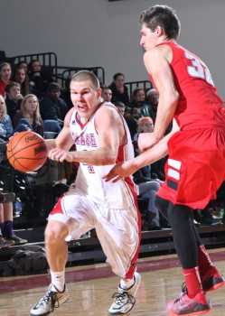 Grace College's Logan Irwin drives against Indiana Wesleyan Tuesday night. (Photos provided by the Grace College Sports Information Department)