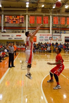 Nick Sands lets fly with a jumper for the Tigers.