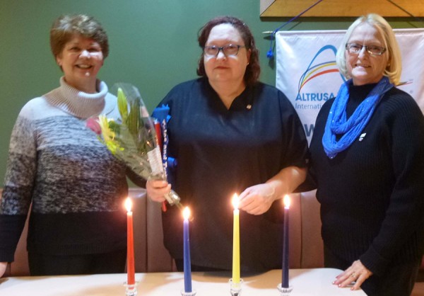 Mary Corwin (center) was the newest member initiated into the Altrusa Club of Warsaw on Jan. 22 by membership committee member, Martie Lennane (right).  Corwin’s sponsor, Sue Creighton, is on the left.