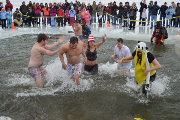 Some of the participants at the Polar Plunge prepare to exit the water back onto the beach at Oakwood Resort. (Photo by Keith Knepp)