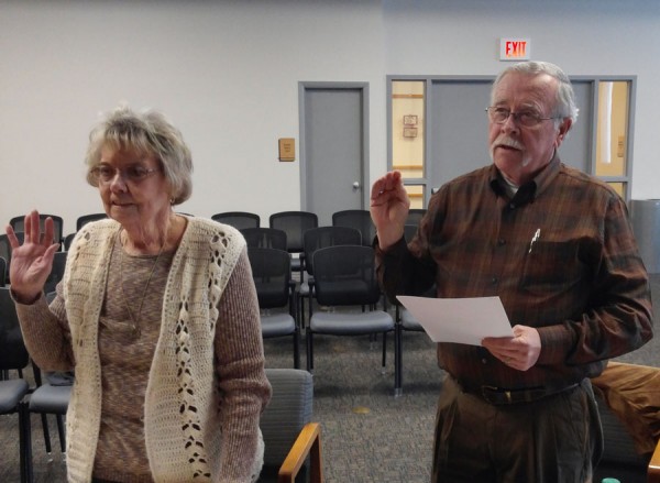 Shelia Bruner and Joe Streeter take the oath of office for Warsaw-Wayne Township Fire Territory Advisory Board. (Photo by Deb Patterson)